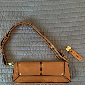 Antonio Melani shoulder bag, tan with black trim.